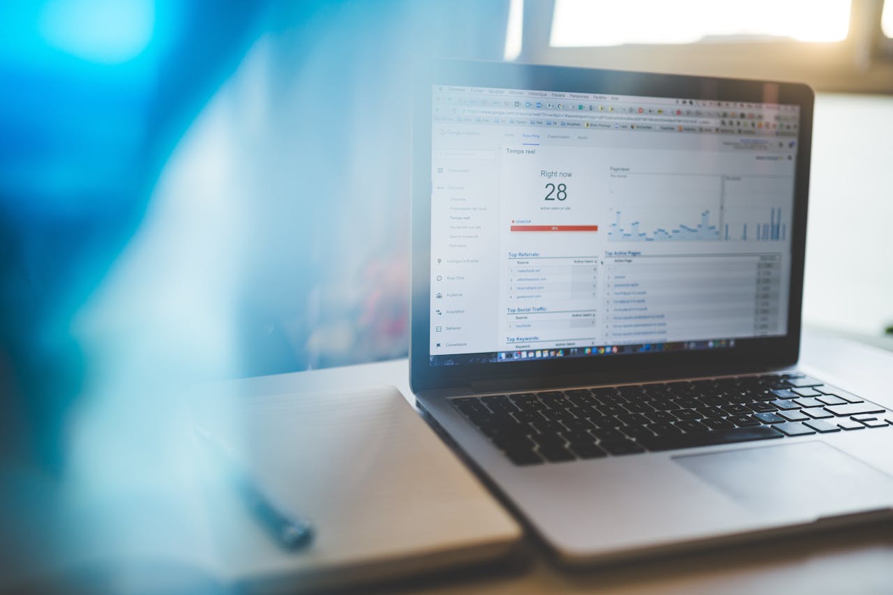 creative Laptop displaying Google Analytics in a modern workspace, highlighting digital analytics and technology.